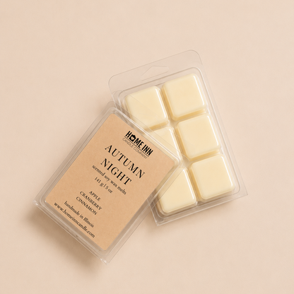 A wax melt package labeled 'Autumn Night' by Home Inn Candle, showing six off-white wax cubes in a clear plastic clamshell with a beige label, photographed on a warm beige background.
