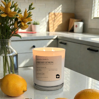 Fresh Lemon Candle from Home Inn Candle with Yellow Flowers and lemons on kitchen counter with home decor. 