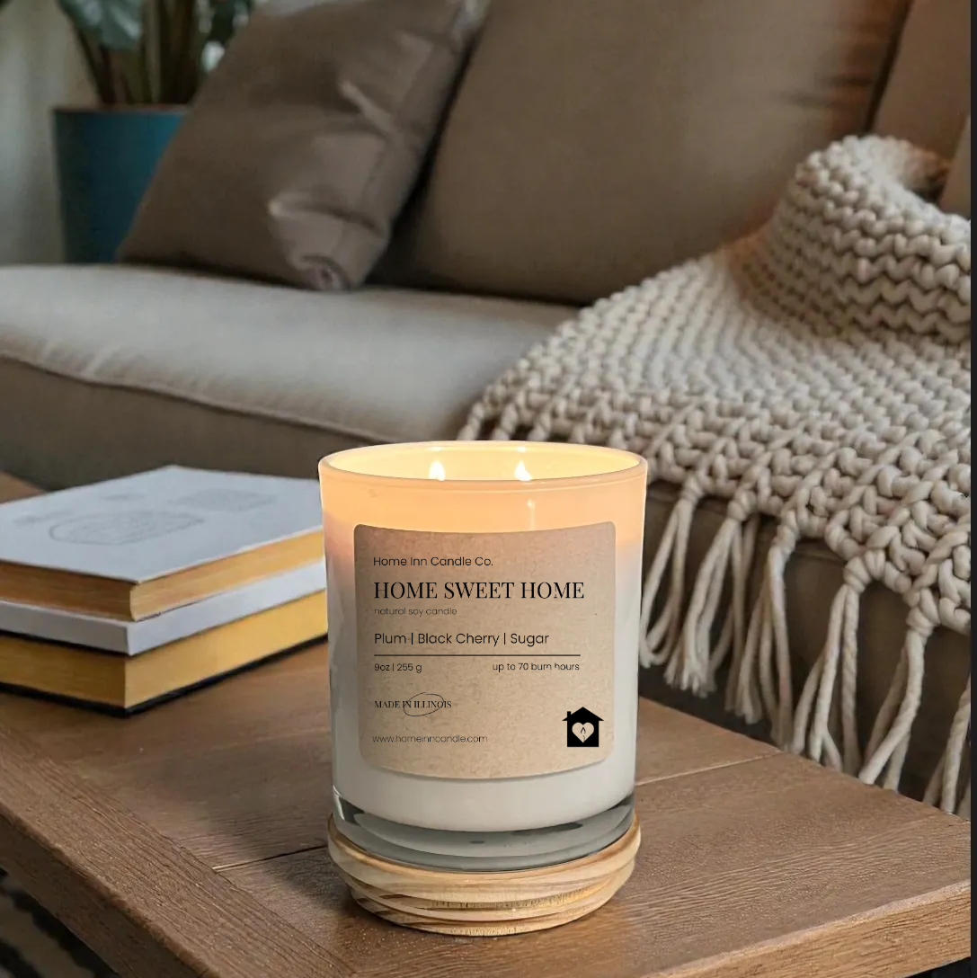Candle labeled 'Home Sweet Home' on a coffee table in a cozy living room.