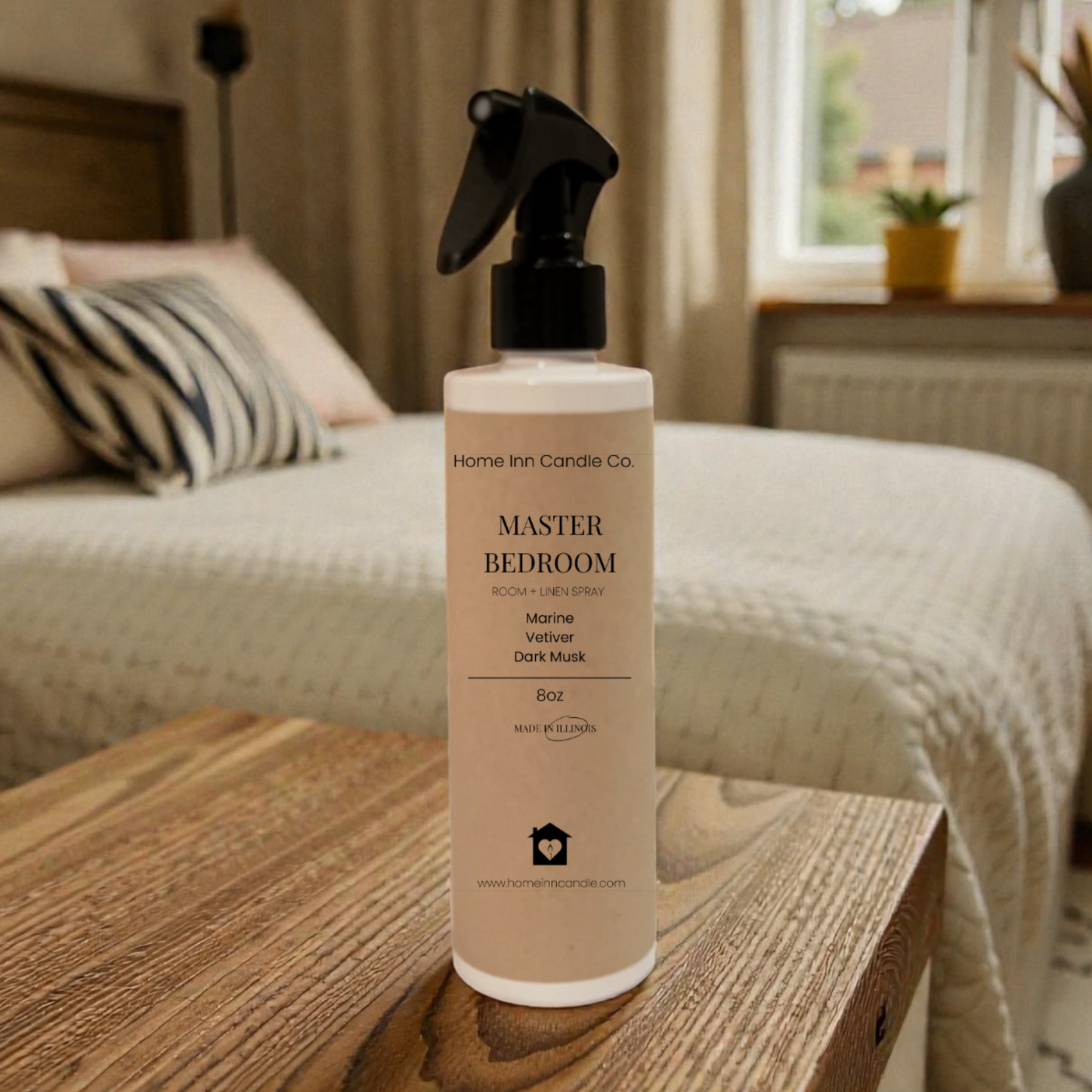 Room Spray Bottle labeled Master Bedroom by Home Inn Candle in a bedroom with home decor