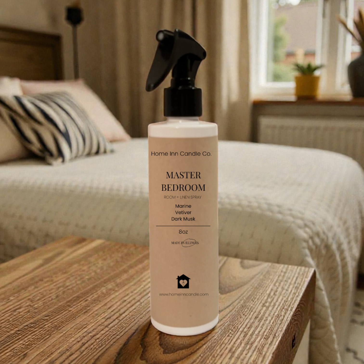 Room Spray Bottle labeled Master Bedroom by Home Inn Candle in a bedroom with home decor