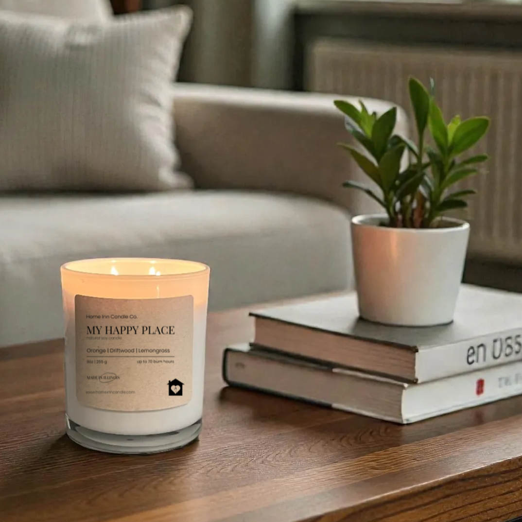 Candle on a wooden table with a plant and books in a cozy living room.