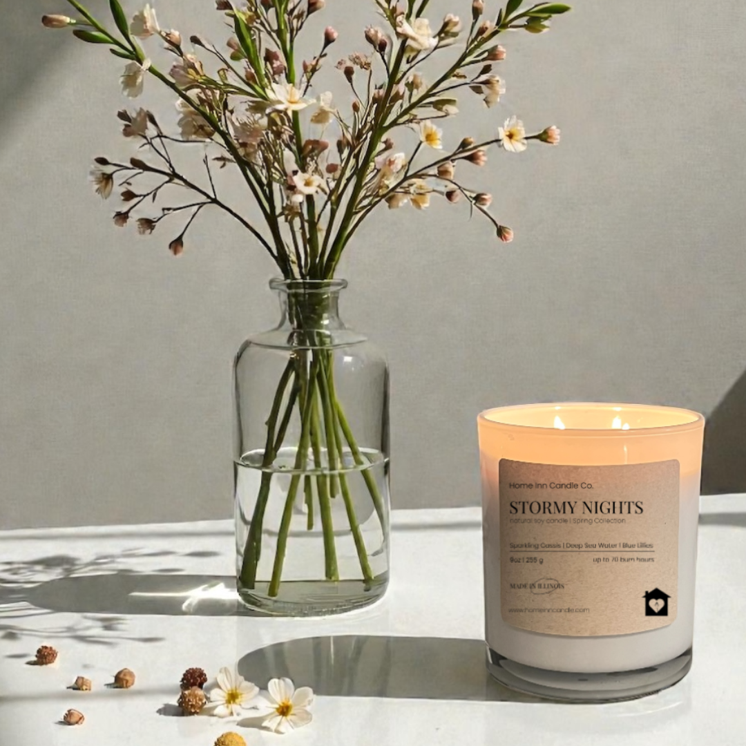 Stormy Nights Candle from Home Inn Candle with flowers on a white table