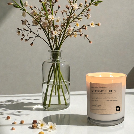 Stormy Nights Candle from Home Inn Candle with flowers on a white table